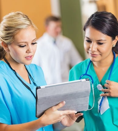 nurses looking at iPad