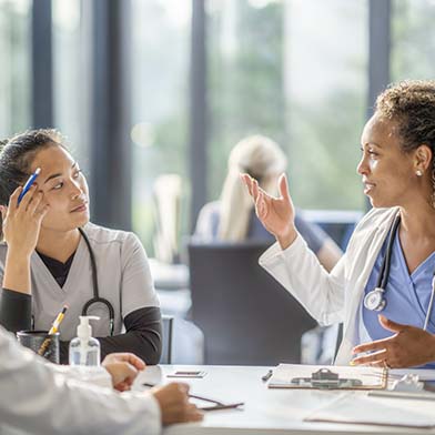 A group of medical professionals in a meeting