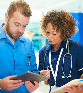 nurses looking at the tablet