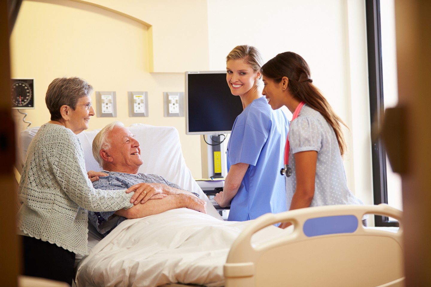 nurse with patient and family